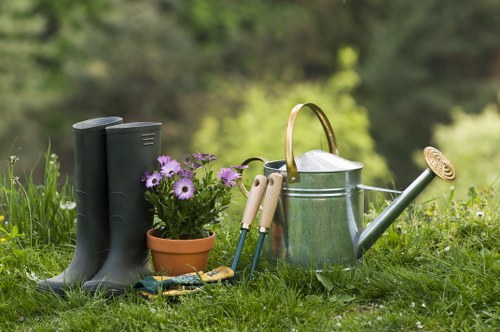 Gardener discussing a complaint beside a garden border